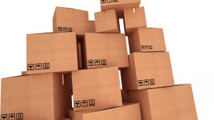 Stacks of cardboard boxes isolated on white background closeup
